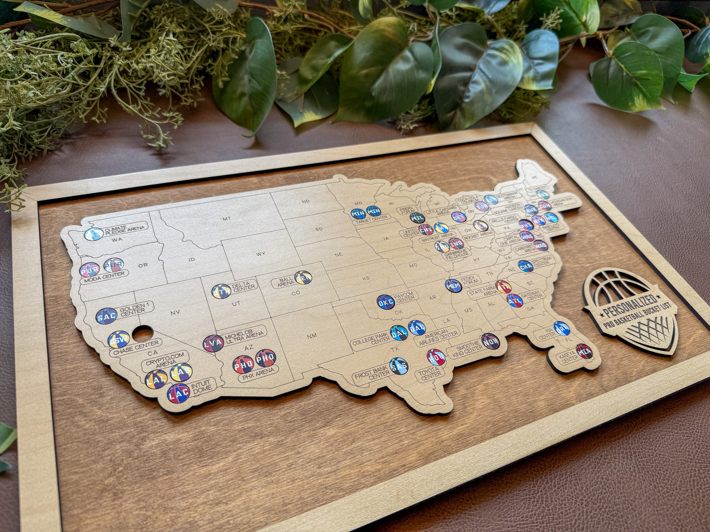 Wooden map of the United States with pins on a wooden board