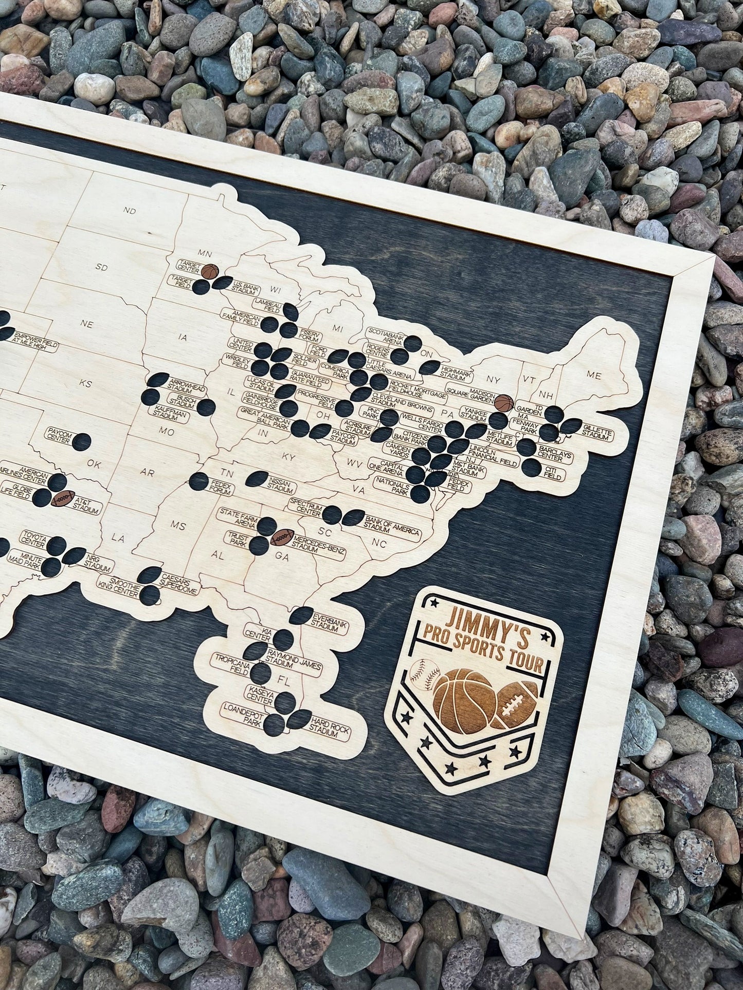 football, baseball, basketball multi sport map on dark wood backing.