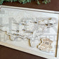 A wall-mounted map showcasing the locations of Presidential Libraries in the United States with a wooden frame and markers. The map is labeled with 'Bucket List' and 'Presidential Libraries'. natural on natural