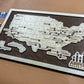 wooden airport travel map on dark wood stain backing