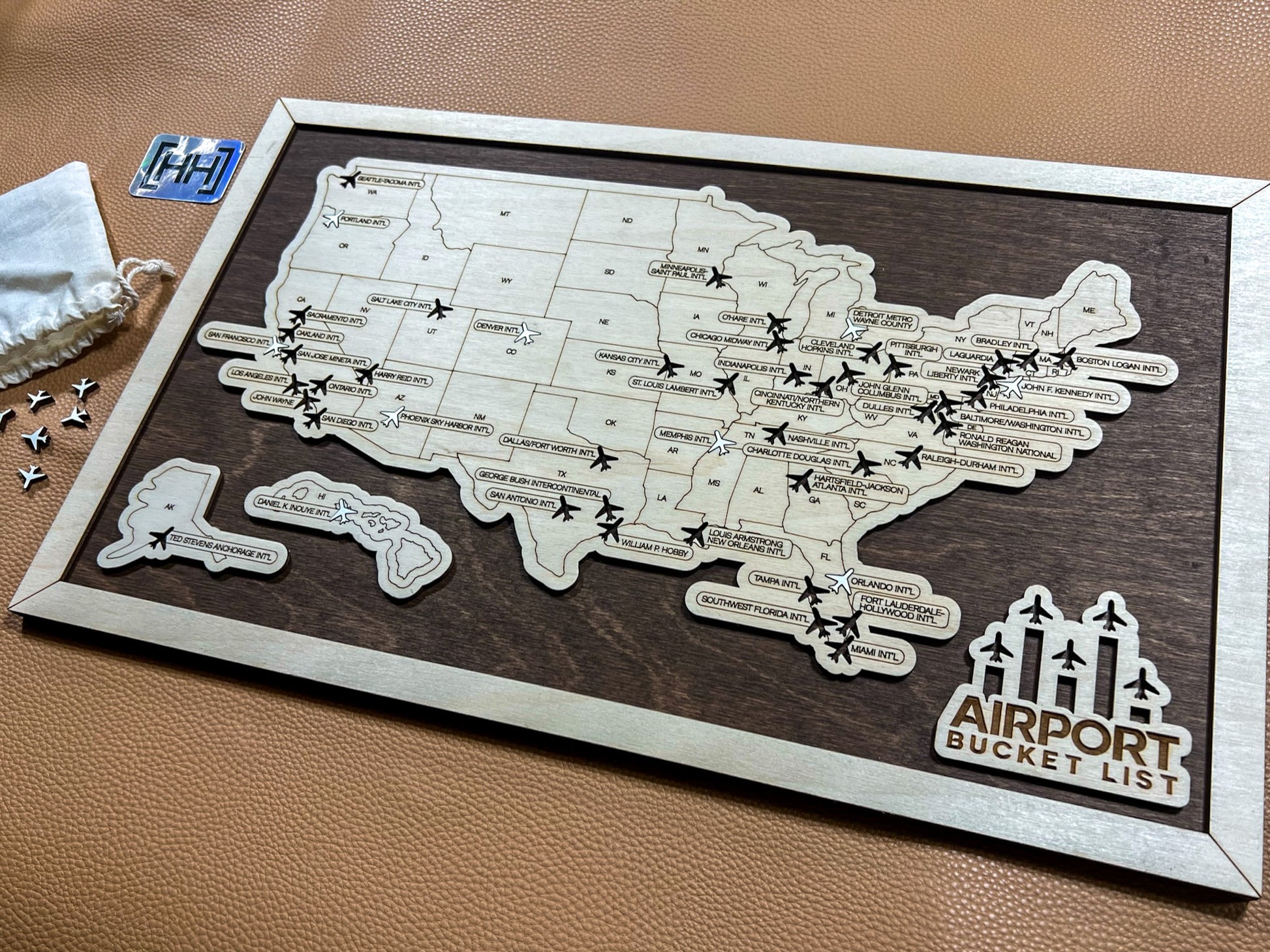 wooden airport travel map on dark wood stain backing