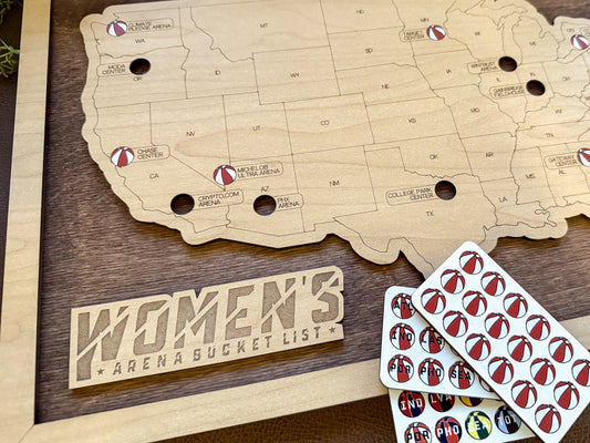 Wooden map of the United States with 'Women's Arena Bucket List' sign and sticker token sheets.