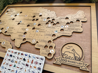 Wooden map with animal stickers and a 'Zoo Bucket List' sign