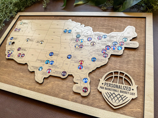 Wooden map of the United States with basketball-themed pins on a wooden board.