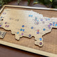 Wooden map of the United States with pins marking locations, basketball map.