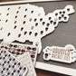Decorative elements including a coffin-shaped cutout, ghost stickers, and 'Haunted Bucket List' on a dark surface.