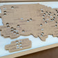 Wooden map of the United States with engraved text on a white background