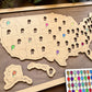 Wooden map of the United States with pins and a color swatch on a wooden board.