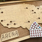Wooden map of the United States with 'Arena Bucket List' branding and a small card with stickers on a wooden surface.