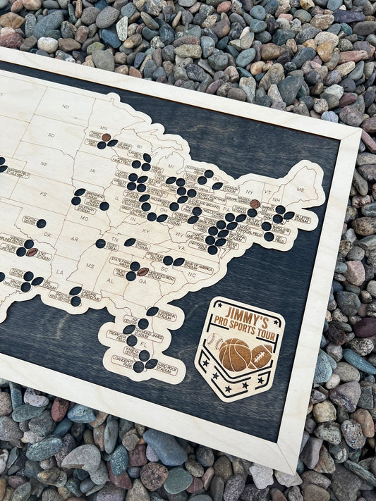 football, baseball, basketball multi sport map on dark wood backing.